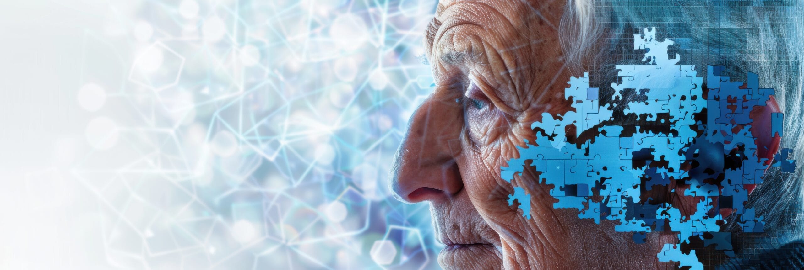 World Alzheimer's Month. Man's head surrounded by by puzzle pieces. Horizontal banner, copy space. Portrait of an old man symbolizing brain dysfunction